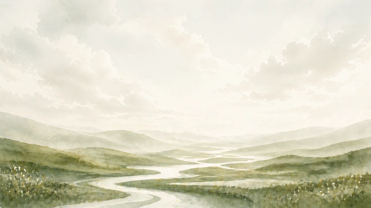 A river winding through soft green hills under a pale sky.